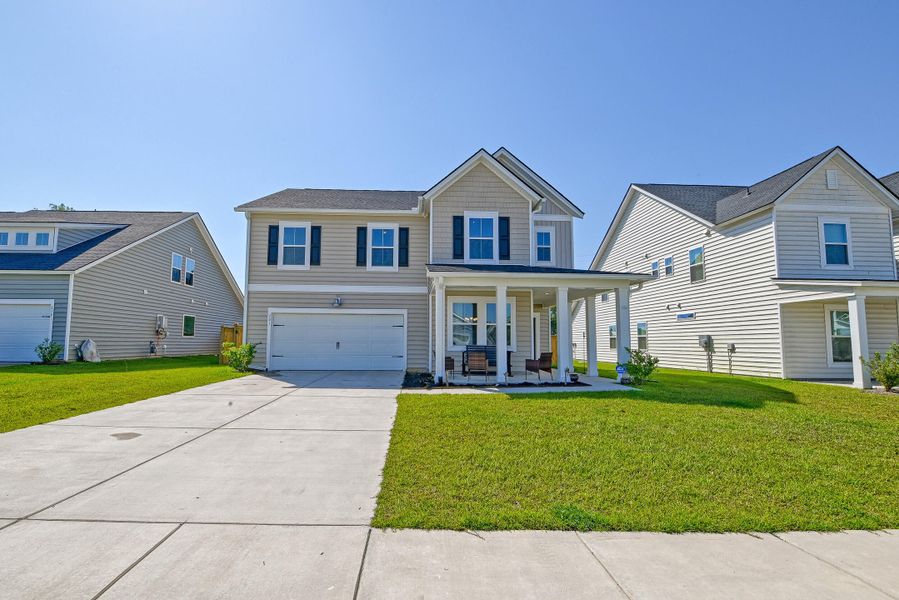 Front exterior of a new home in Heron's Walk at Summers Corner, Summerville, SC, highlighting curb appeal (Image 21).