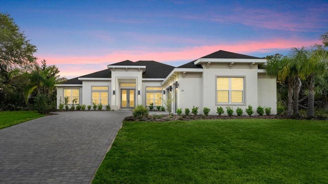 Front exterior of a new home in , Palm Coast, FL, highlighting curb appeal (Image 23).
