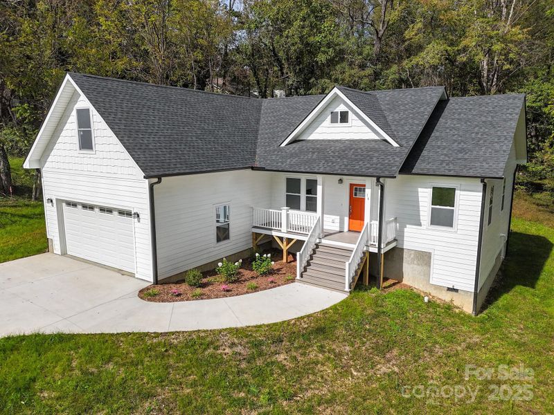 Front exterior of a new home in , Candler, NC, highlighting curb appeal (Image 25). Front exterior of a new home in , Candler, NC, highlighting curb appeal (Image 25).