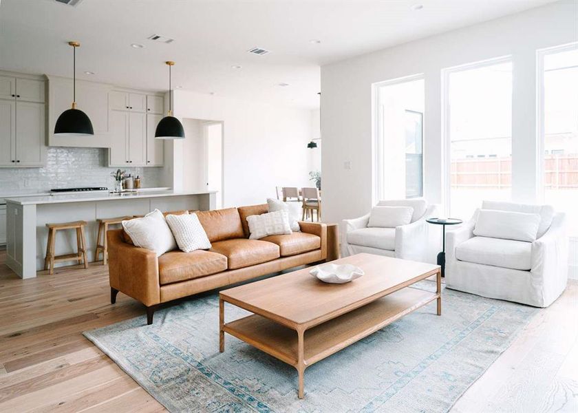 Living room with light hardwood / wood-style flooring