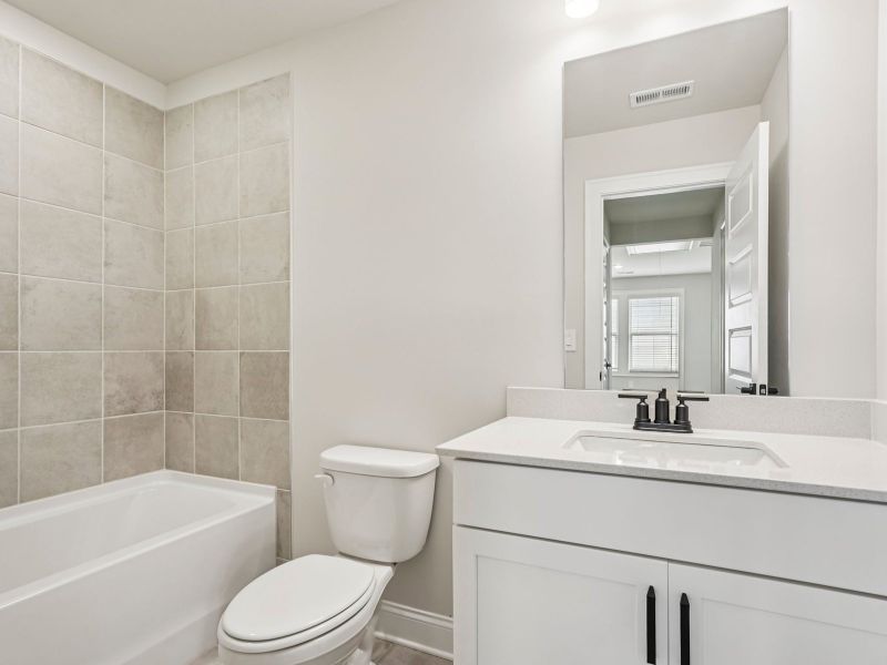 The Dallas Basement floorplan with the Upscale Rustic Linen interior package.