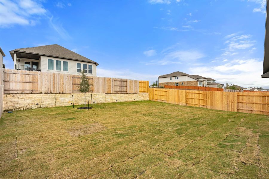 Exterior details and patio area of a home in Lariat, Liberty Hill (Image 27).