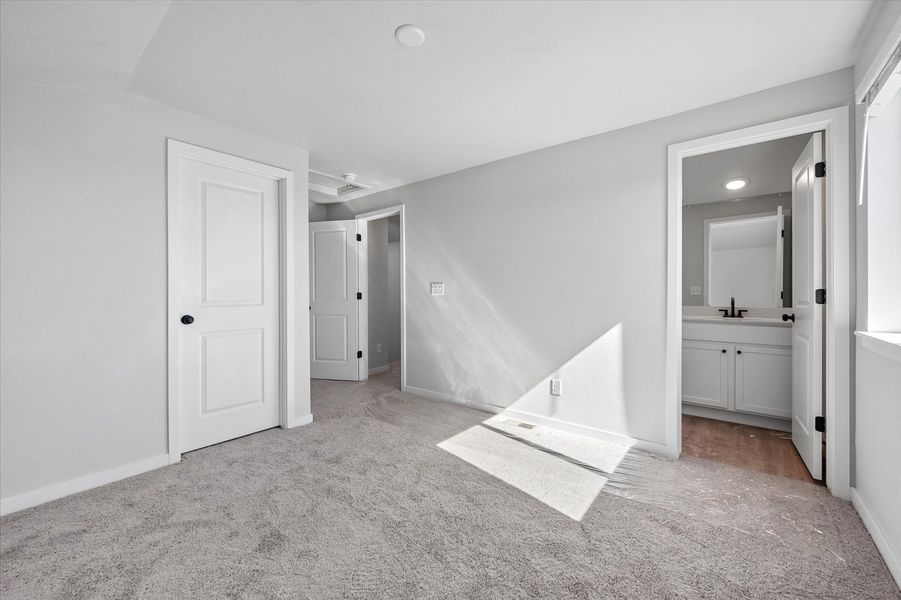 A bathroom with white walls.