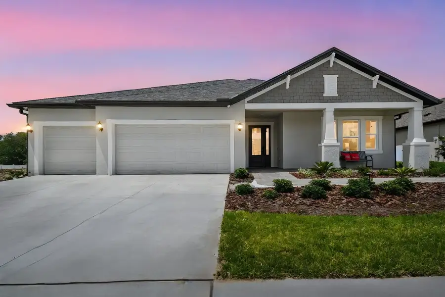Front exterior of a new home in Pinecone Reserve, Brooksville, FL, highlighting curb appeal (Image 18).