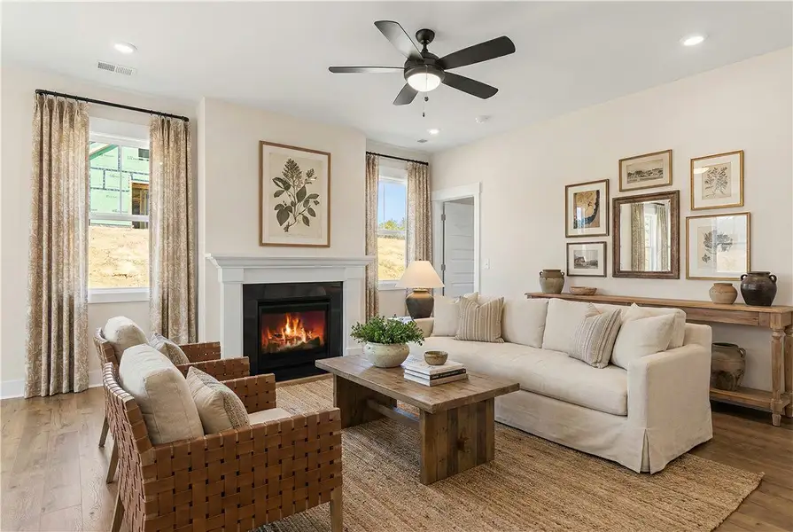 This inviting living area boasts a cozy fireplace,