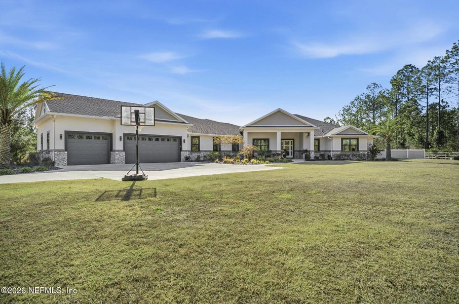 Front exterior of a new home in , Palm Coast, FL, highlighting curb appeal (Image 25). Front exterior of a new home in , Palm Coast, FL, highlighting curb appeal (Image 25).