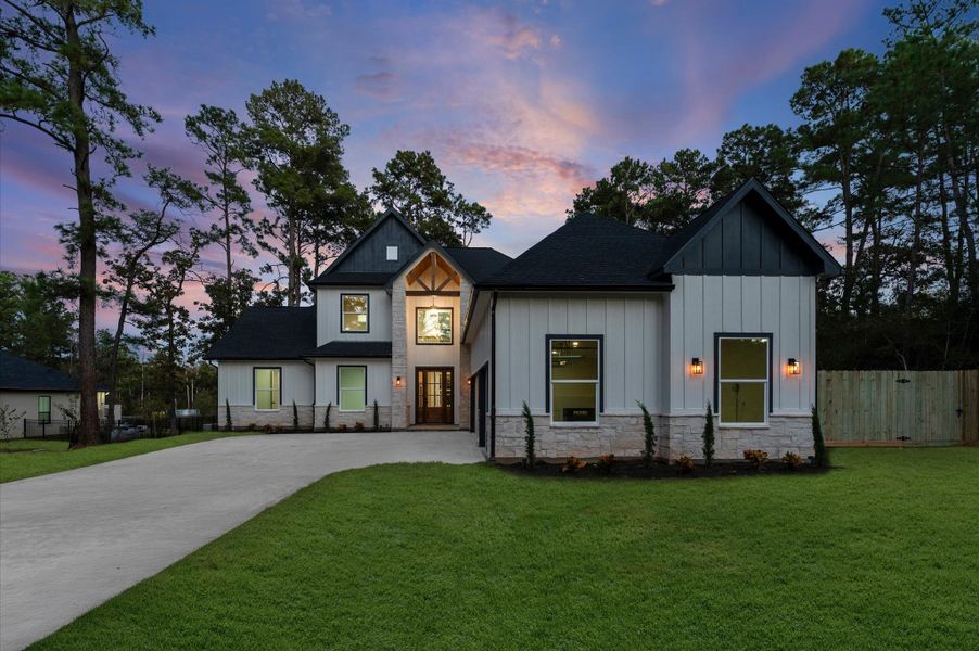 Front exterior of a new home in , Magnolia, TX, highlighting curb appeal (Image 22).