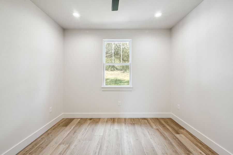 Bright and neutral with recessed lighting and a peaceful view of the surrounding landscape. Bright and neutral with recessed lighting and a peaceful view of the surrounding landscape.