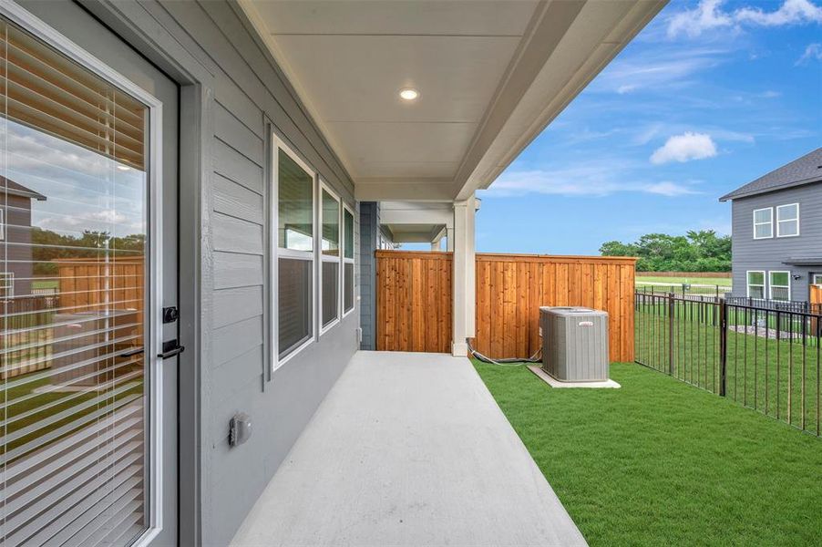 Exterior details and patio area of a home in Providence Commons, Providence Village (Image 19). Exterior details and patio area of a home in Providence Commons, Providence Village (Image 19).