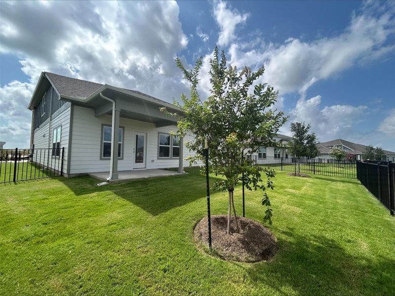 Back of property featuring a patio and a fenced backyard Back of property featuring a patio and a fenced backyard