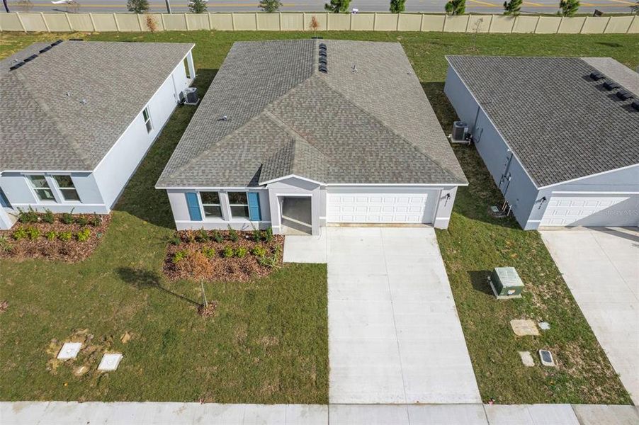 Front exterior of a new home in The Grove at Scenic Terrace, Lake Hamilton, FL, highlighting curb appeal (Image 7).