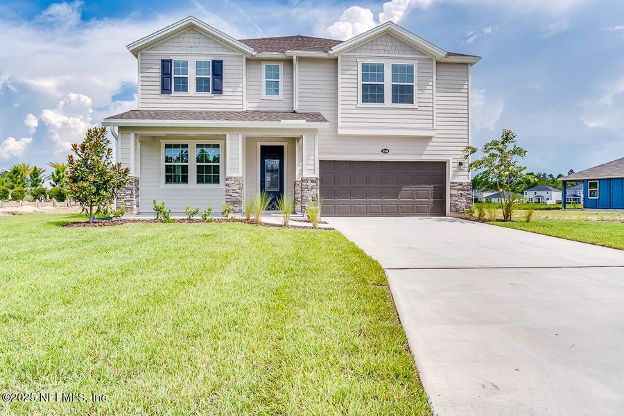 Front exterior of a new home in Copper Ridge, Jacksonville, FL, highlighting curb appeal (Image 17).