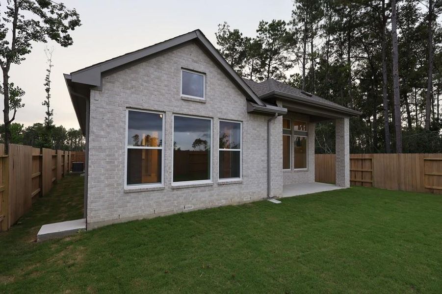 Exterior details and patio area of a home in ARTAVIA 45' Homesites, Conroe (Image 2).