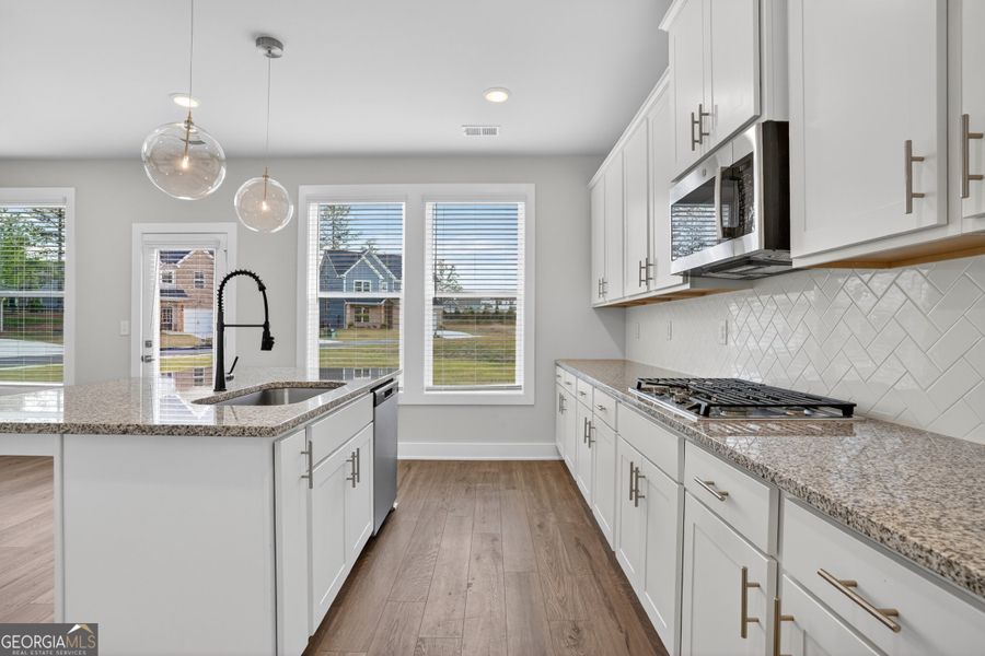 Furnished interior view inside a new home in The Fairways at Mirror Lake, Villa Rica (Image 39).