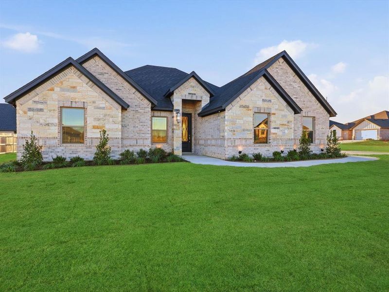 Front exterior of a new home in , Tolar, TX, highlighting curb appeal (Image 24).