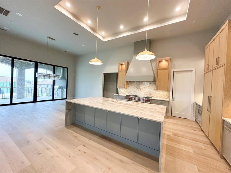 Fabulous custom kitchen with white oaks cabinetry with Taj Mahal countertops.