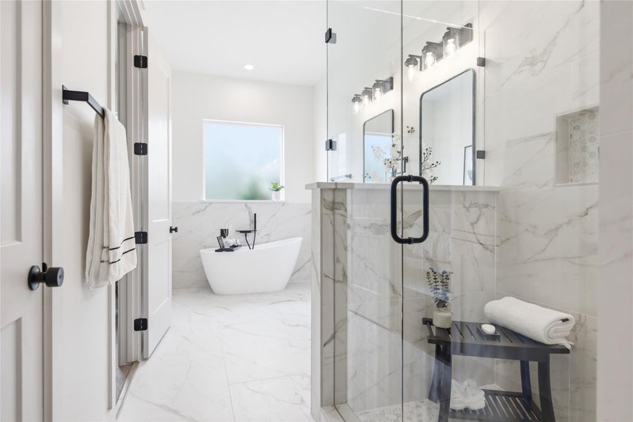 A well-lit primary bathroom features a standalone soaking tub and a glass-enclosed shower. A well-lit primary bathroom features a standalone soaking tub and a glass-enclosed shower.