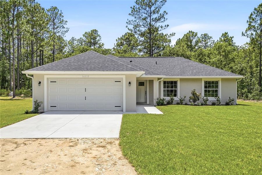Front exterior of a new home in , Weeki Wachee, FL, highlighting curb appeal (Image 1). Front exterior of a new home in , Weeki Wachee, FL, highlighting curb appeal (Image 1).