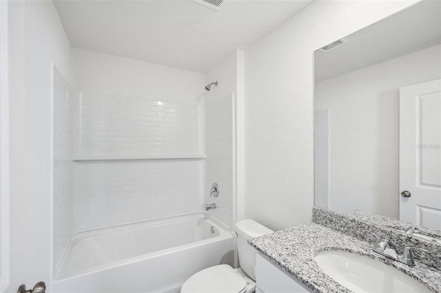 Furnished interior view inside a new home in Eagle Hammock, Eagle Lake (Image 14).