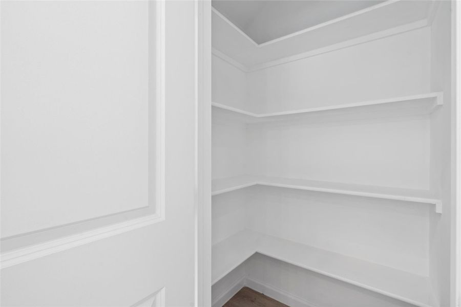 Walk-in pantry provides storage for all your essentials — practical design that keeps everything organized. Walk-in pantry provides storage for all your essentials — practical design that keeps everything organized.