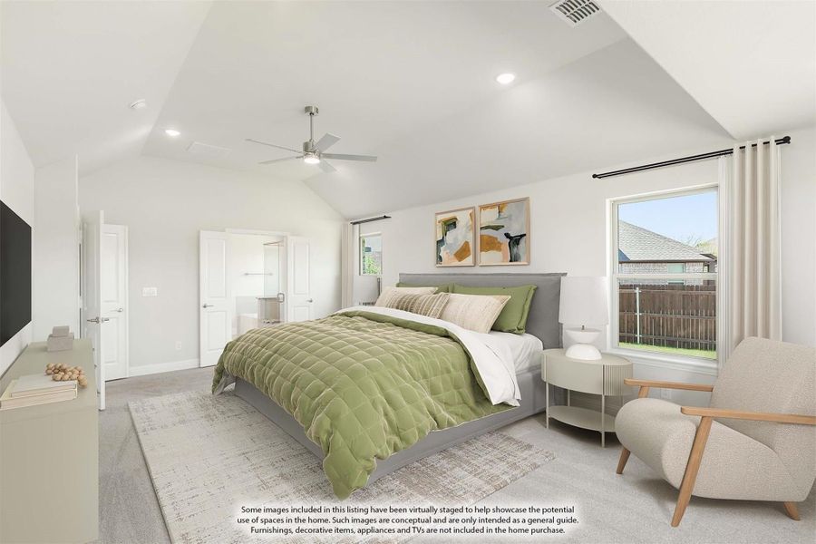 Spacious master bedroom with vaulted ceiling, ceiling fan, and ensuite bathroom door