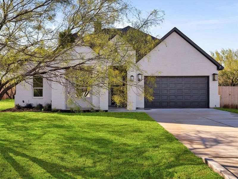 Front exterior of a new home in , Fort Worth, TX, highlighting curb appeal (Image 2).
