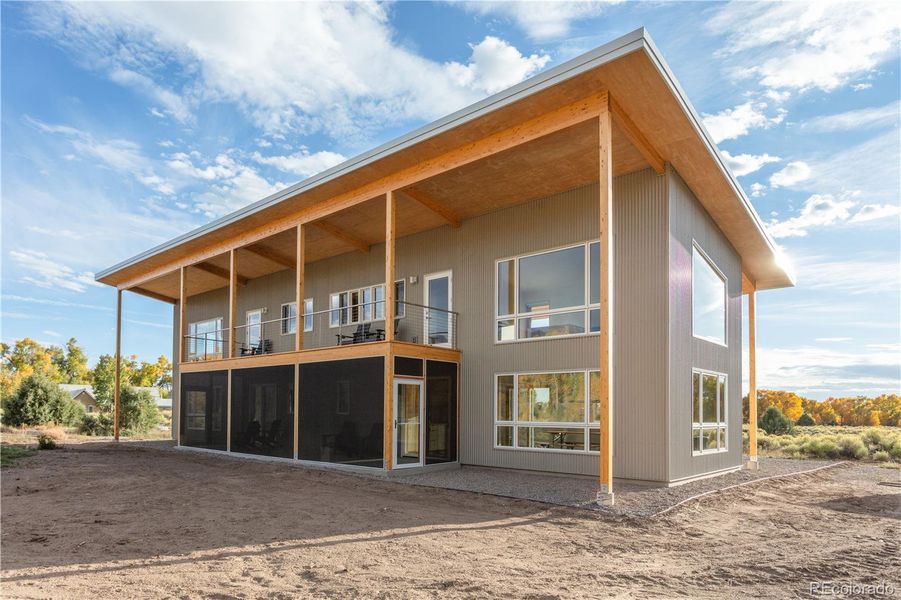 Back view of house. Large picture windows facing east for spectacular views of Crestone Peak, Crestone Needle and Humboldt Peak.
