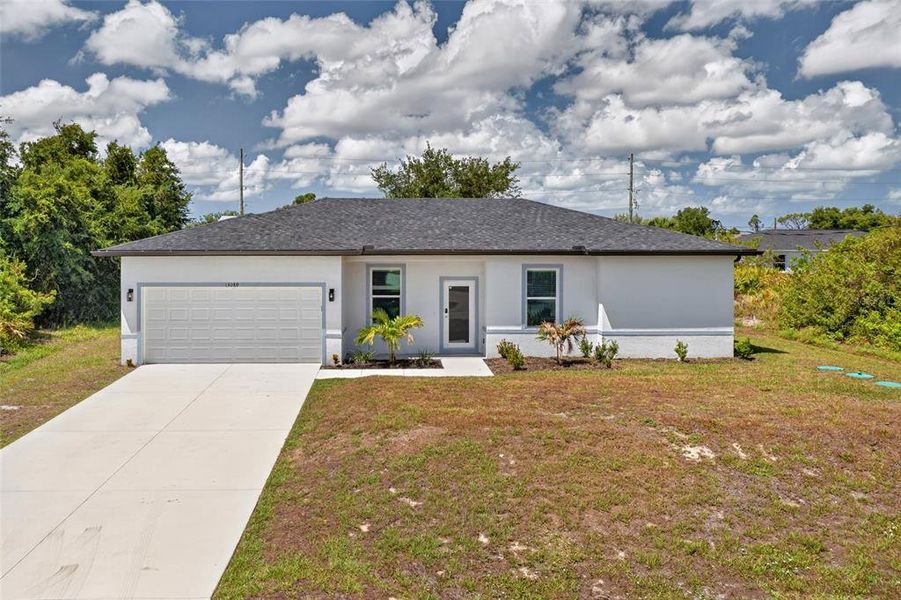 Front exterior of a new home in , Port Charlotte, FL, highlighting curb appeal (Image 20). Front exterior of a new home in , Port Charlotte, FL, highlighting curb appeal (Image 20).