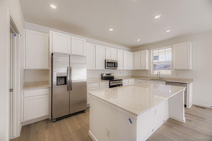 Furnished interior view inside a new home in Ken-Caryl Ranch: The Pioneer Collection, Littleton (Image 6).