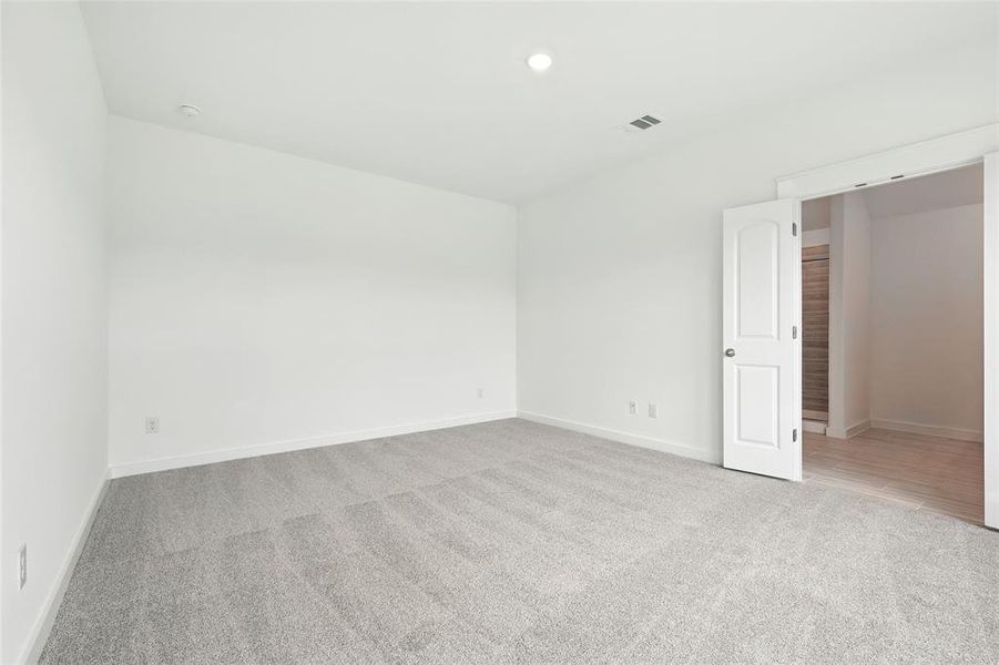 Unfurnished room featuring light carpet and recessed lighting