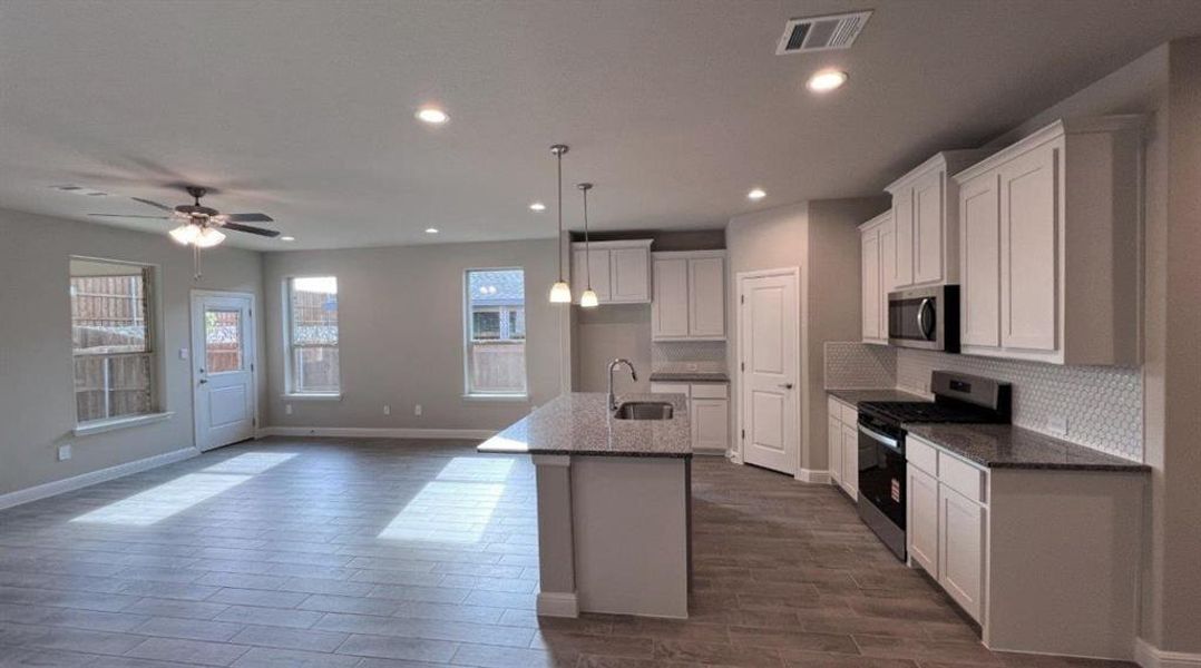 Furnished interior view inside a new home in Bluestem, Rhome (Image 6). Furnished interior view inside a new home in Bluestem, Rhome (Image 6).