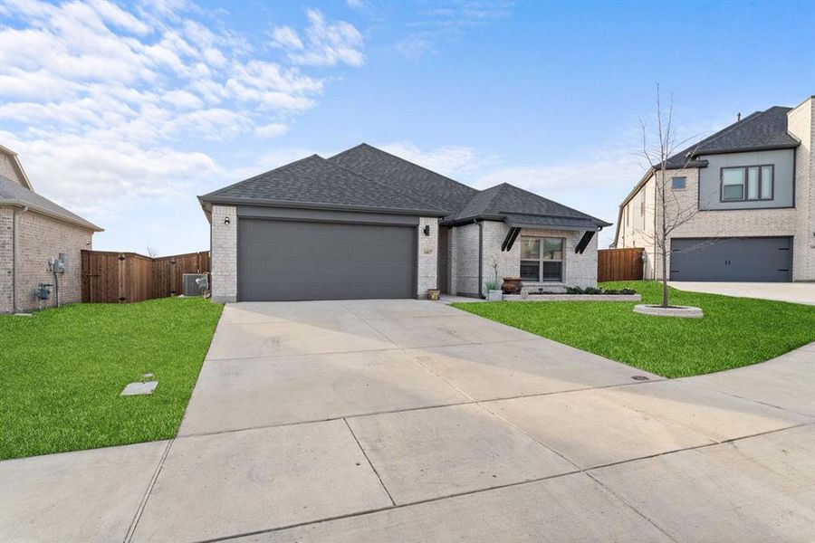 Front exterior of a new home in Madero, Haslet, TX, highlighting curb appeal (Image 2). Front exterior of a new home in Madero, Haslet, TX, highlighting curb appeal (Image 2).