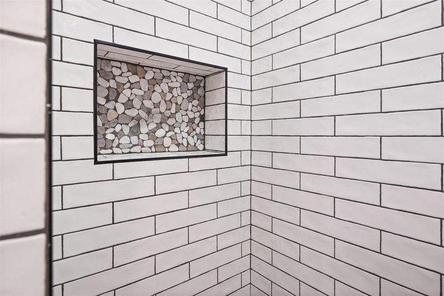 Full bath with a tile shower