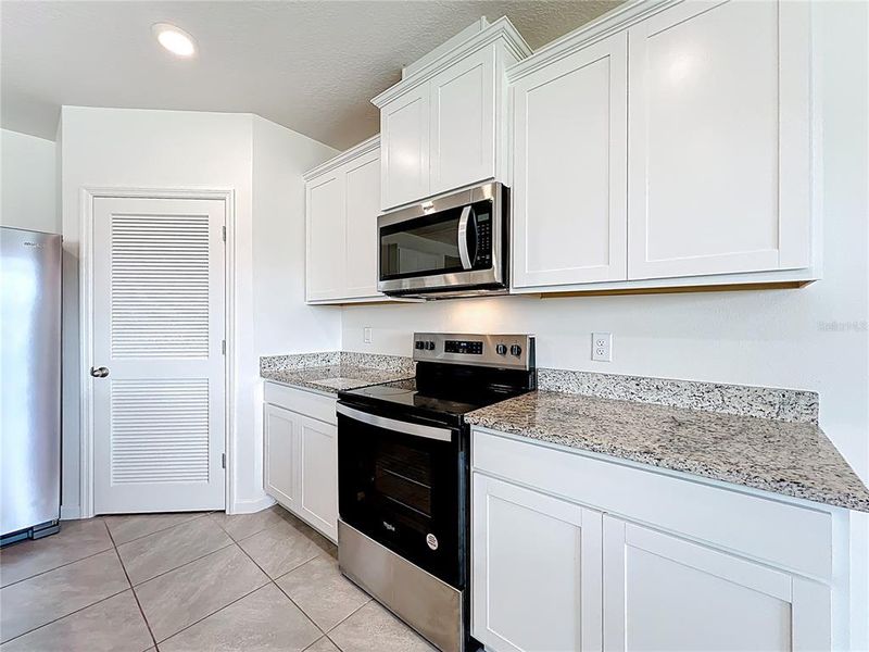 Furnished interior view inside a new home in Cypress Bay West, Palm Bay (Image 10).