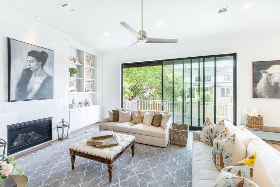 Family room from a previous Lovett Home with stacking doors for seamless indoor/outdoor living.