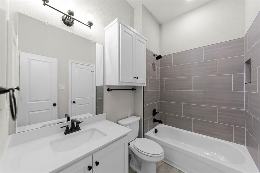 Full bathroom with vanity and tub / shower combination