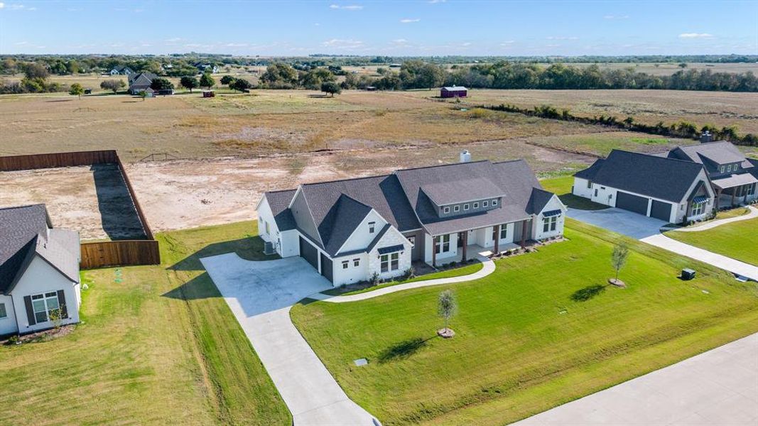 Birds eye view of property with a rural view