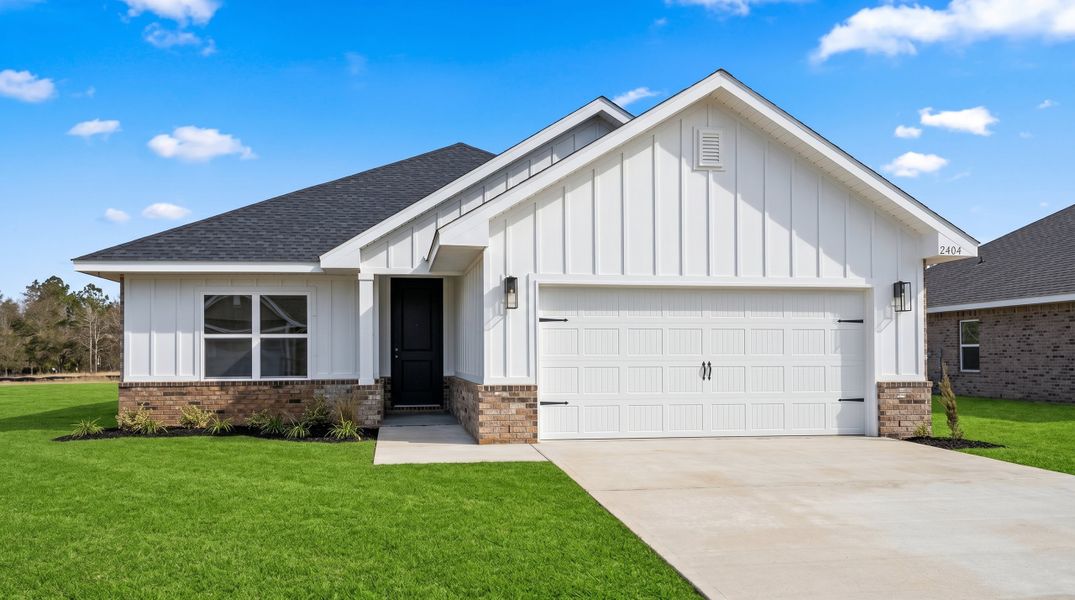 Front exterior of a new home in Brookwood, Crestview, FL, highlighting curb appeal (Image 1). Front exterior of a new home in Brookwood, Crestview, FL, highlighting curb appeal (Image 1).