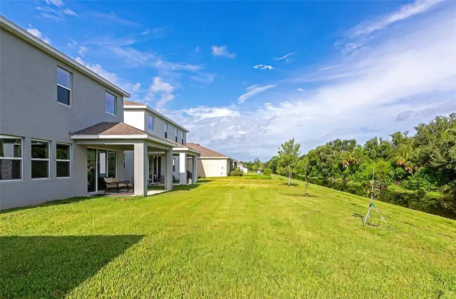 Front exterior of a new home in , Apollo Beach, FL, highlighting curb appeal (Image 21).