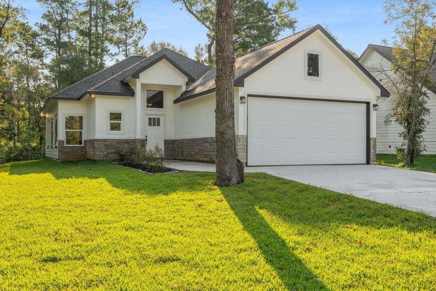 Front exterior of a new home in , Willis, TX, highlighting curb appeal (Image 2). Front exterior of a new home in , Willis, TX, highlighting curb appeal (Image 2).