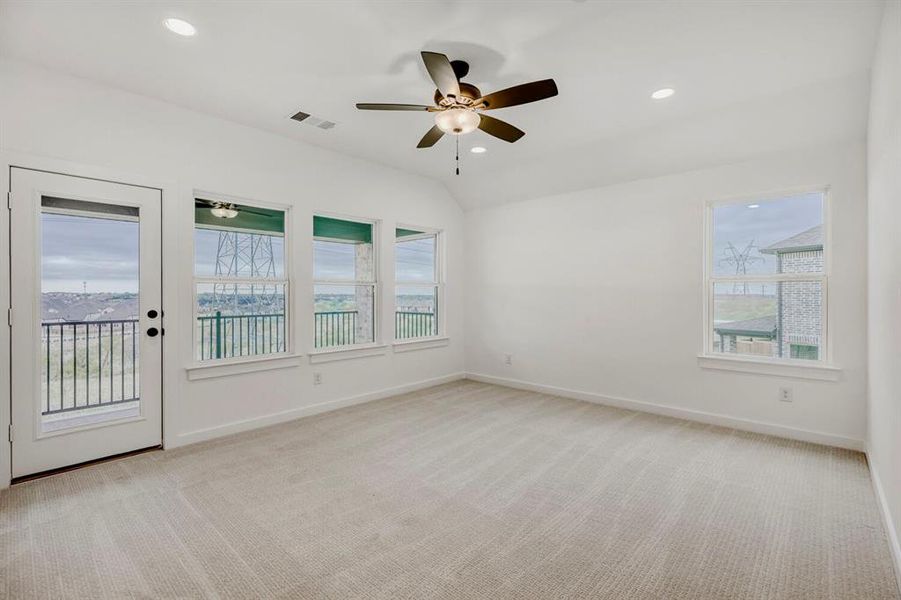 Carpeted room with white walls, recessed lighting, and a ceiling fan