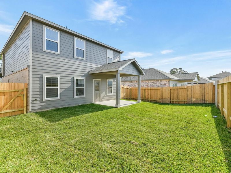 Exterior details and patio area of a home in Lakes at Black Oak, Magnolia (Image 22).