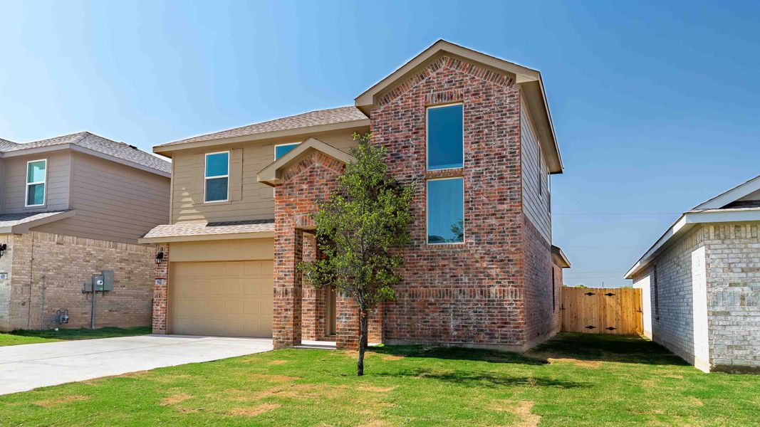 Representative exterior photo of a completed home built from the The Kendall by D.R. Horton in Overlook West, Wolfforth, TX (Image 2).
