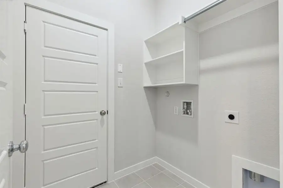 Utility Room in the Ash home plan by Trophy Signature Homes – REPRESENTATIVE PHOTO