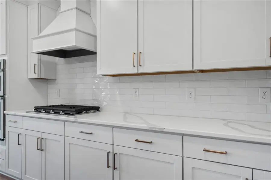A refined kitchen showcasing sleek cabinetry and a A refined kitchen showcasing sleek cabinetry and a
