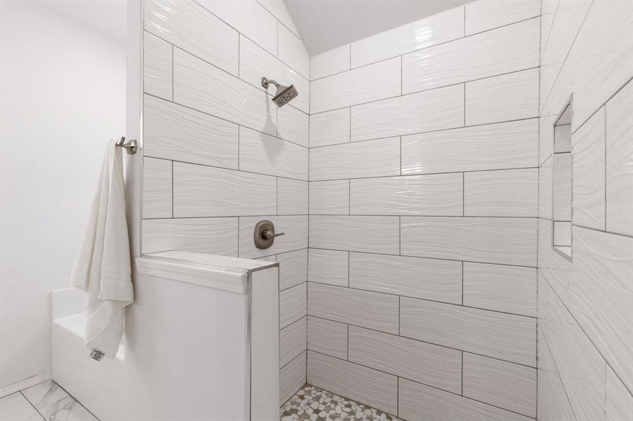 Bathroom with a tile shower