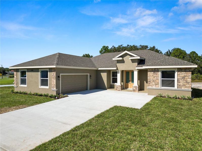 Front exterior of a new home in , Sebring, FL, highlighting curb appeal (Image 26). Front exterior of a new home in , Sebring, FL, highlighting curb appeal (Image 26).
