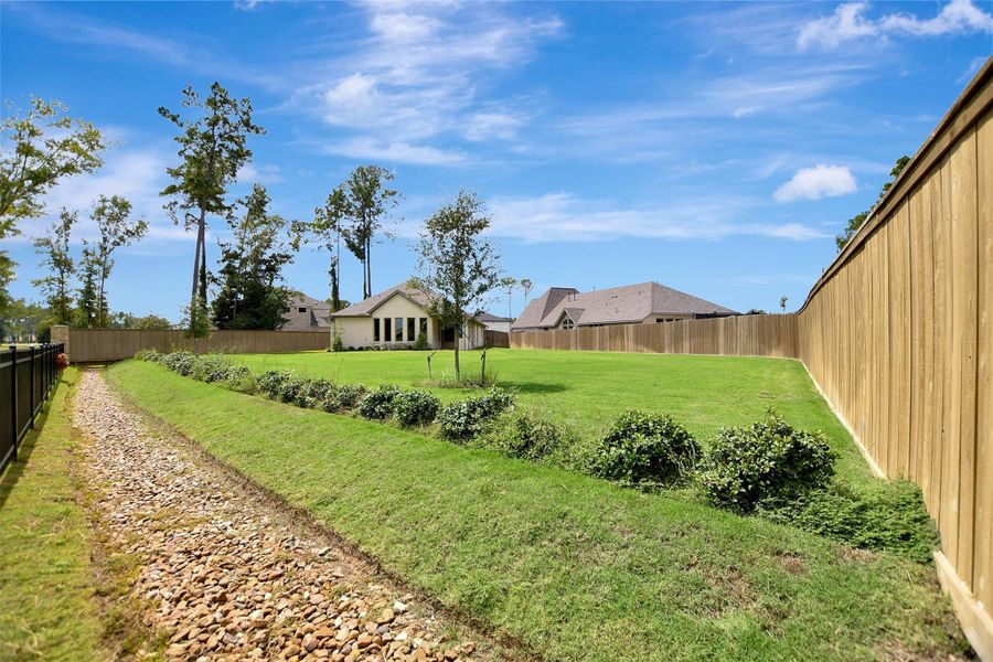 Exterior details and patio area of a home in The Highlands, Porter (Image 27).