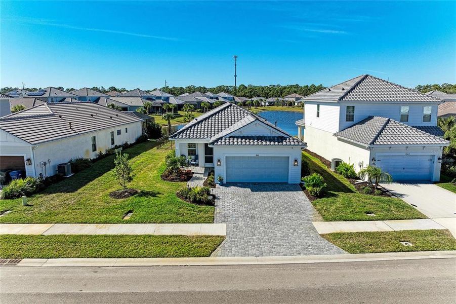 Front exterior of a new home in , Sarasota, FL, highlighting curb appeal (Image 26). Front exterior of a new home in , Sarasota, FL, highlighting curb appeal (Image 26).