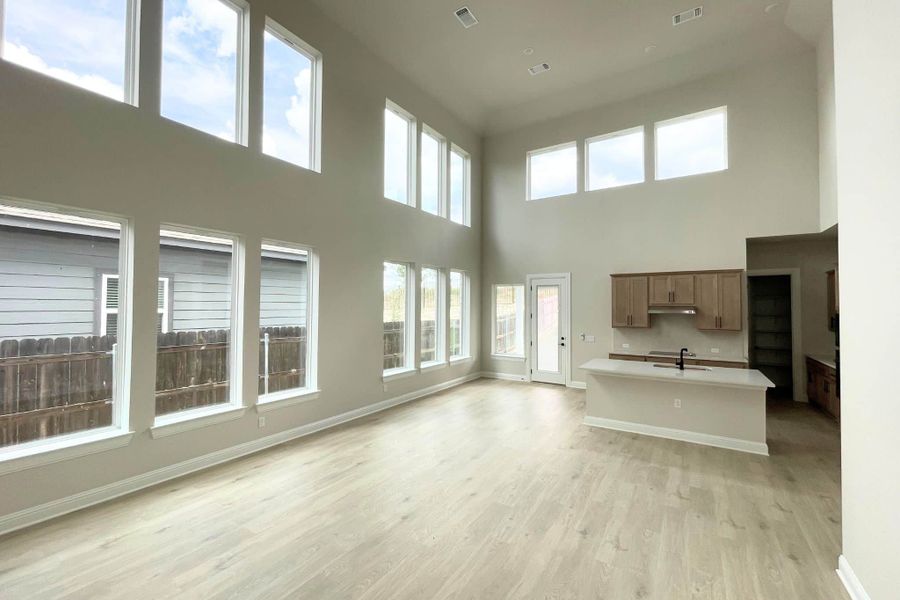Spacious, unfurnished interior of a new home in Whisper Valley, Manor (Image 24).